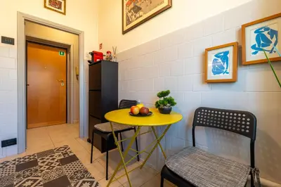 a small yellow table and chairs in a room at NEW Luxury-On-Budget in Rome