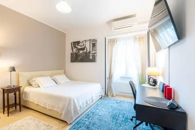 a bedroom with a bed and a desk with a computer at NEW Luxury-On-Budget in Rome