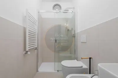 a bathroom with a shower with a toilet and a sink at Imperial Luxury in Rome