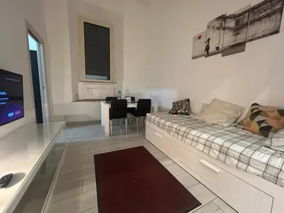 a living room with a couch and a table at Statilia Urban Retreat in Rome