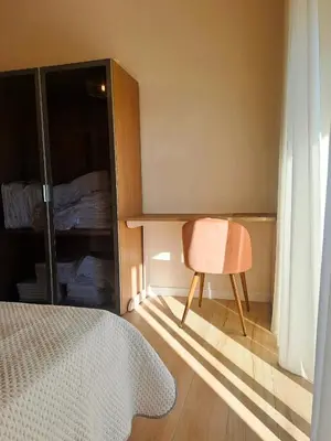 a bedroom with a desk and a chair next to a bed at Elegance Penthouse 959 in Rome
