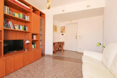 a living room with a couch and a tv at Julia Apartment in Rome