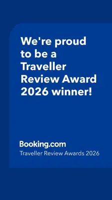 a blue sign that says were proud to be a traveller reviewagency winner at CA' MATI Alloggio Turistico Vaticano in Rome