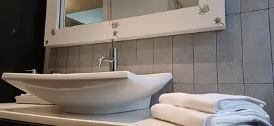 a white sink on a counter in a bathroom at CA' MATI Alloggio Turistico Vaticano in Rome