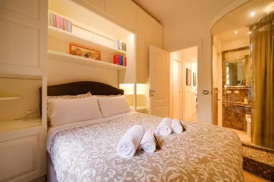 a bedroom with a bed with towels on it at Ad un passo da San Pietro in Rome