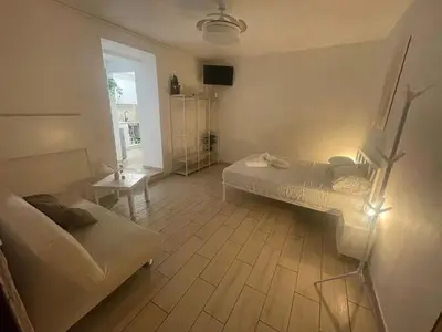 a room with three chairs and a table in it at Vicolo 17 in Rome
