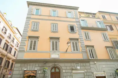 a large building in the middle of a street at Sistina 138 Luxury Home in Rome