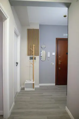 a hallway with a door and a room with a floor at Sara's Home - Modern Apartment Near Metro, Perfect for Families and Groups in Rome in Rome