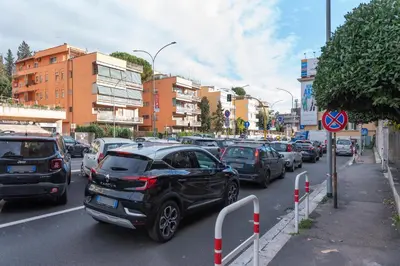 a bunch of cars parked in a parking lot at GoldStar apartments in Rome