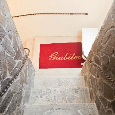 a set of stairs with a red sign on it at Hotel Giubileo in Rome