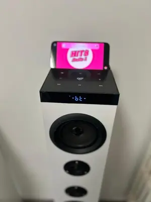 a white and black machine with a pink clock on it at San Giovanni Studio in Rome