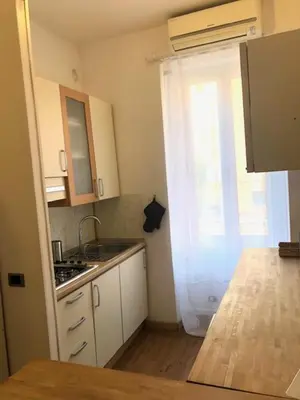 a small kitchen with a sink and a window at Mattia Home in Rome
