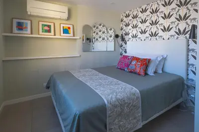 a bedroom with a bed with a blue bedspread at Terrazze di Venere in Rome