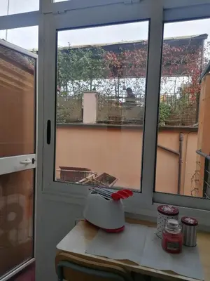 a kitchen with a window and a blender on a counter at All'angolo di San Pietro - wifi in Rome