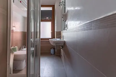 a bathroom with a sink and a toilet at Trinità Dei Monti in Rome