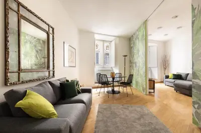 a living room with a couch and a table at Luxury Apartment Spanish Steps in Rome