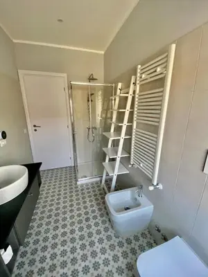 a bathroom with a shower and a toilet and a sink at Attico con balcone in Rome