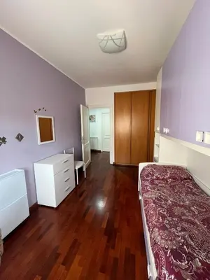a bedroom with a bed and a dresser in it at MichelleHouse in Rome