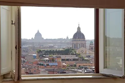 a view of a city from a window at Piazza di Spagna Cozy House & Amazing View in Rome