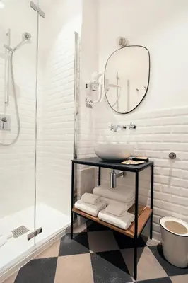 a bedroom with a bed and a table with a book at Pepe's Place - Guest House Manzoni in Rome