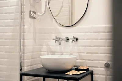 a bedroom with a bed and a desk at Pepe's Place - Guest House Manzoni in Rome