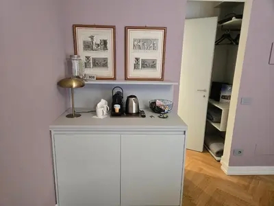 a bedroom with a bed and a desk at Pepe's Place - Guest House Manzoni in Rome