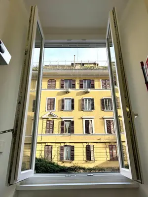 a window with a view of a building at Vacanze Romane at Furio Camillo in Rome