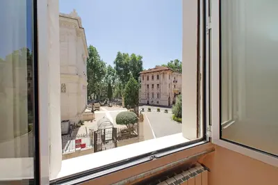 an open window with a view of a street at Luxury home in the Ghetto's heart in Rome