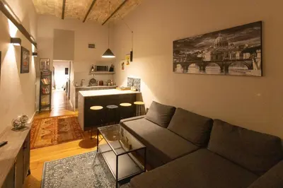 a living room with a couch and a table at Trastevere Spot in Rome