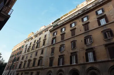 a large brick building with lots of windows at Termini in Bed in Rome