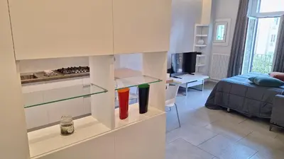 a room with a room with a bed and a kitchen at Casa Gabri in Rome