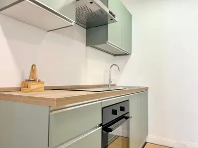 a kitchen with a sink and a counter top at Sergio I Apartment in Rome