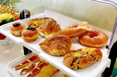 a tray filled with different types of pastries at Antico Platano in Rome