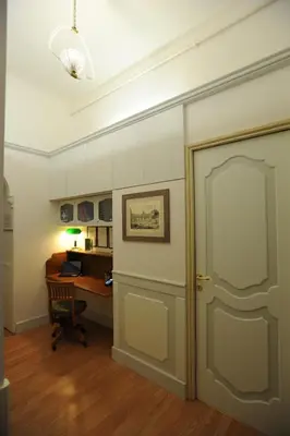 an office with a door and a desk with a computer at Startermini in Rome