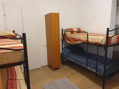 a room with two bunk beds and a cabinet at Tom 38 in Rome