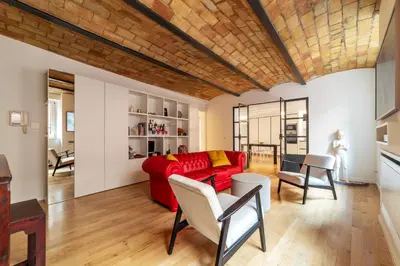 a living room with a red couch and chairs at Luxury 3 beds 3 baths, few steps from city center in Rome