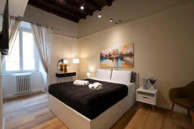 two stuffed animals sitting on a bed with blue walls at Designer Apartment 5' Pantheon Wi-Fi & AC in Rome