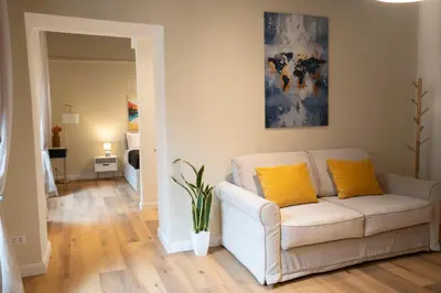 a living room with a table and chairs at Designer Apartment 5' Pantheon Wi-Fi & AC in Rome