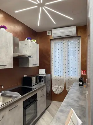 a kitchen with a sink and a microwave at Breath of Rome 5 min a piedi metro B San paolo poche fermate dal centro di Roma in Rome