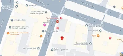 a bedroom with a large bed and a lamp at Domus Porta Furba in Rome