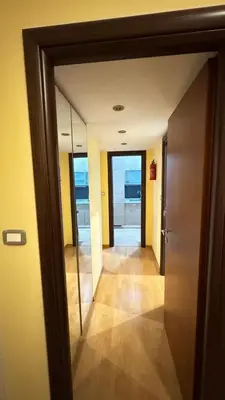 a hallway with a door leading into a room at Casa Gemelli Gemelli in Rome