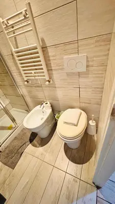 a bathroom with a toilet and a sink at Kotel rome residenza piazza bologna in Rome