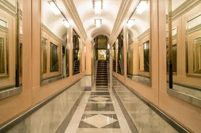 a hallway of a building with a staircase in it at The Inn at the Spanish Steps Prestige Collection - MDR Penthouse in Rome