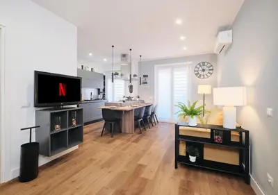 a living room with a kitchen and a dining room at COLOSSEO a 15 minuti - Suite Elegante in Centro in Rome