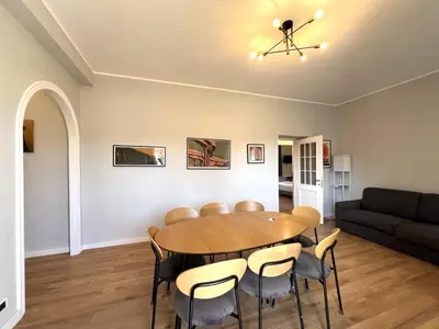 a dining room with a table and chairs at L'affaccio sul borgo - Adiacente Metro B in Rome