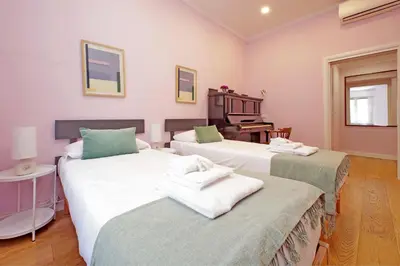a room with two beds with towels on them at 4BNB - Ripetta Central Apartment in Rome