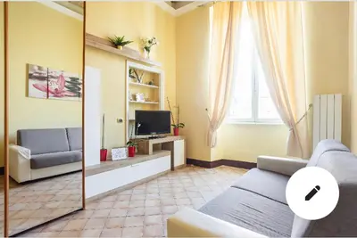 a living room with a couch and a tv at 3C Domus St Peter Roma Centro 
