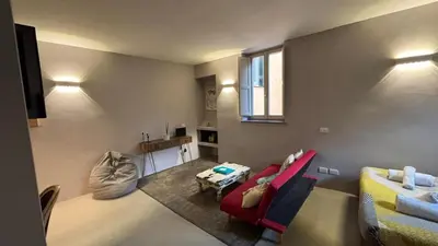 a living room with a couch and a table at La casa di zoe in Rome