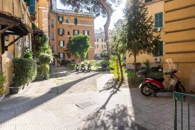 a scooter parked on the side of a street at Domus Magnagrecia in Rome