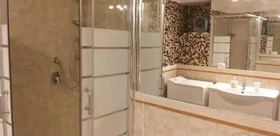 a bathroom with a shower and a sink and a mirror at Bijoux de Rome Navona Luxury Apartment in Rome